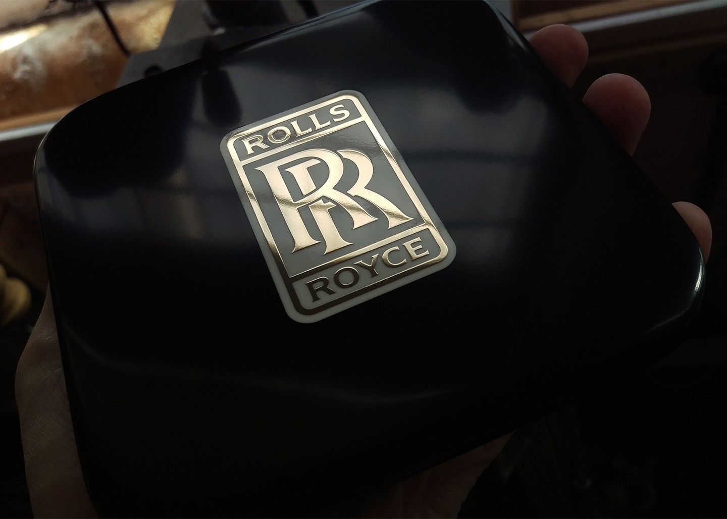 A drinks coaster in Corian, brass and resin