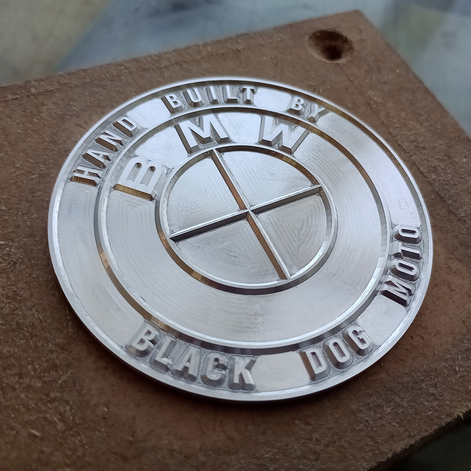 Bare aluminium badge