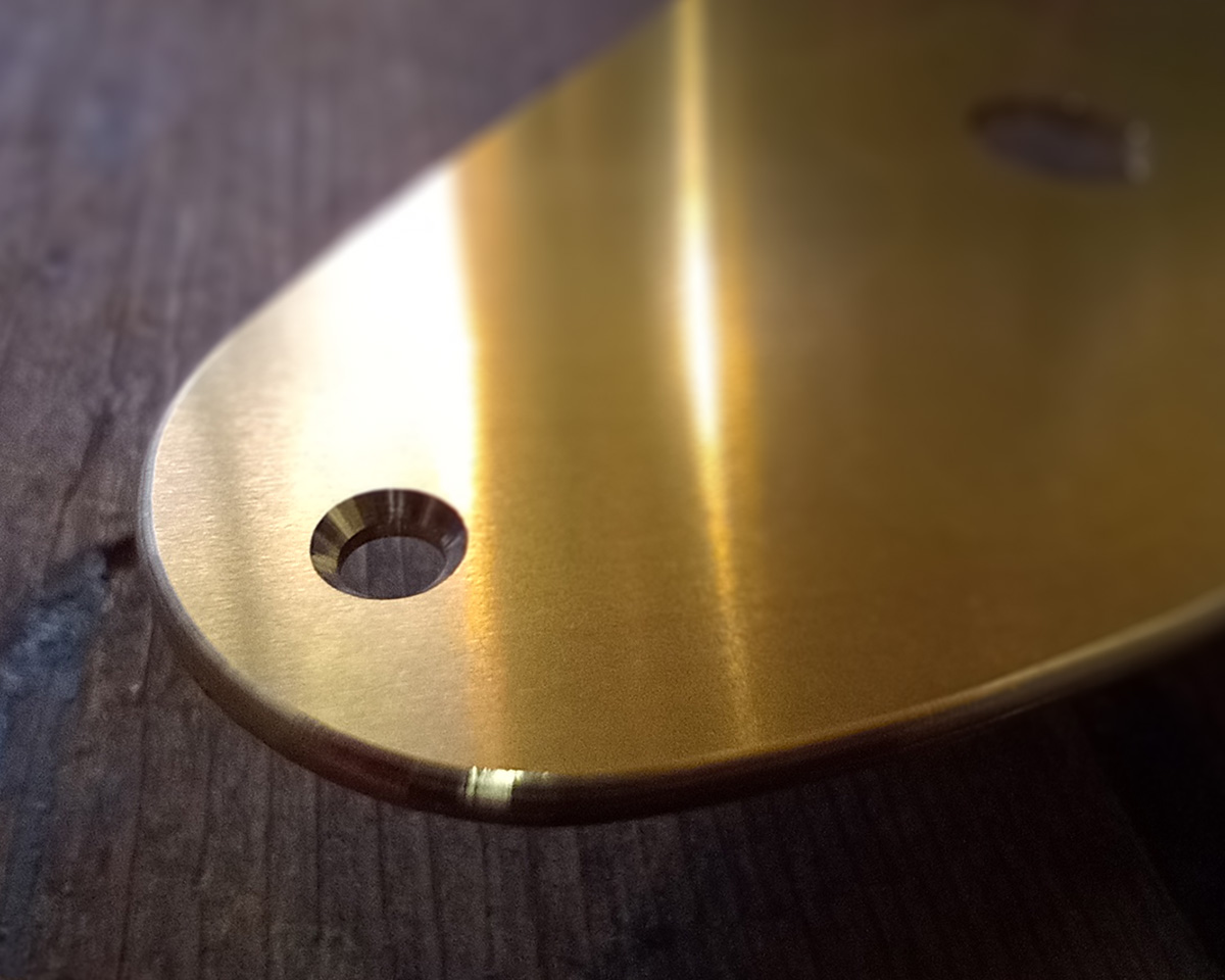 Detail from solid brass pick-guard