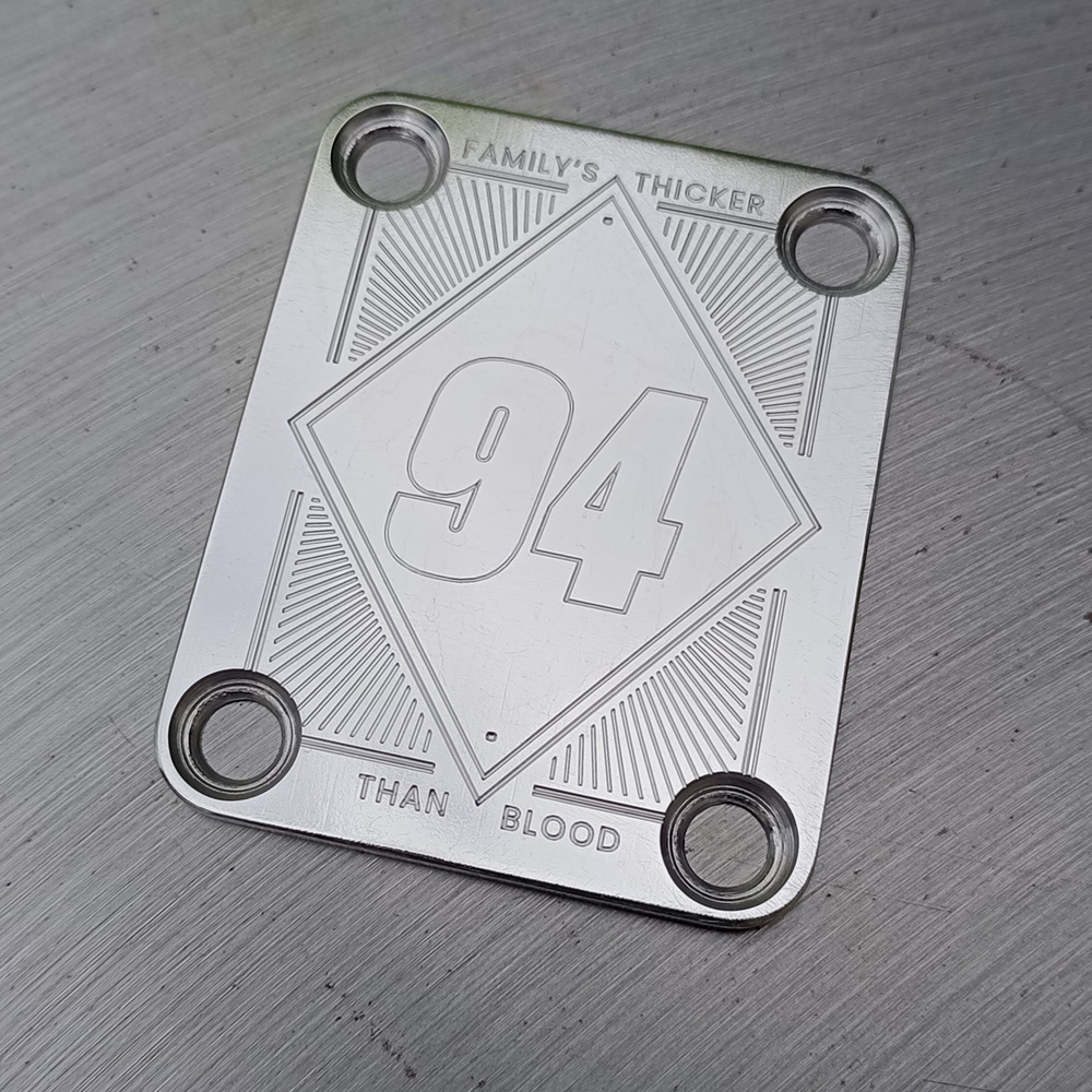 Engraved stainless neck-plate