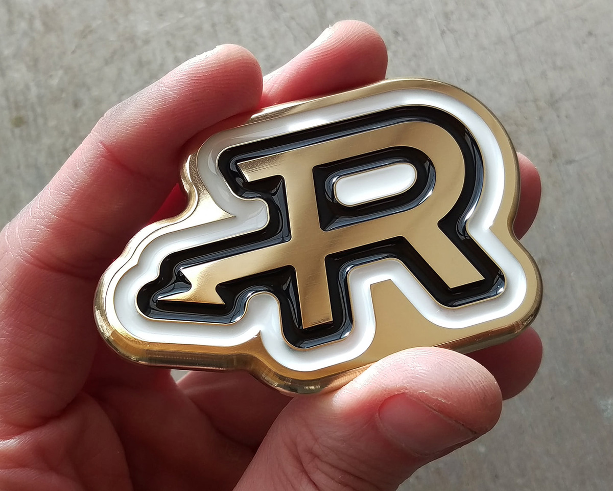 An example of a brass and resin motorycle fuel tank emblem.