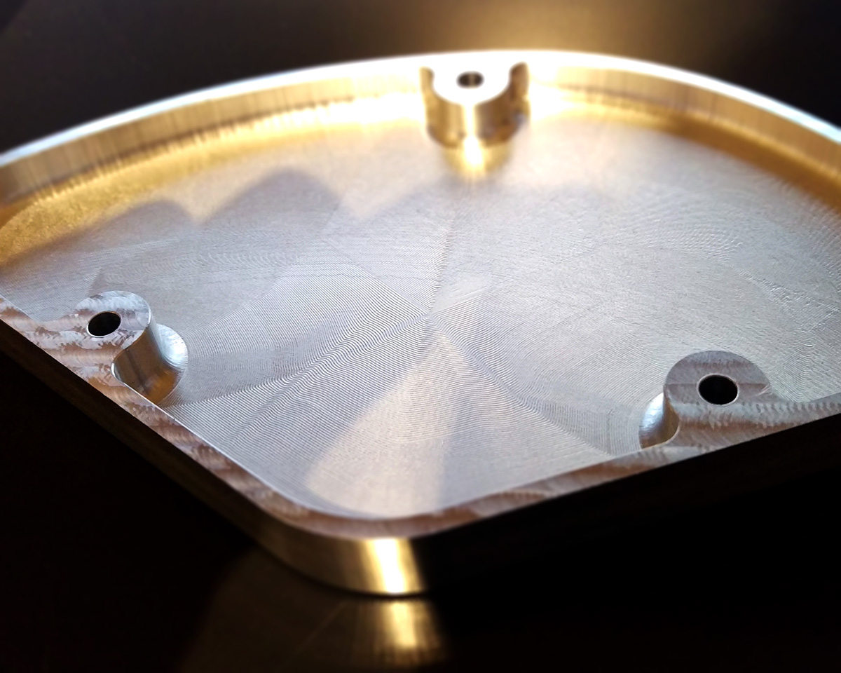 Interior features of an aluminium control cavity cover plate made for a JJL One guitar.